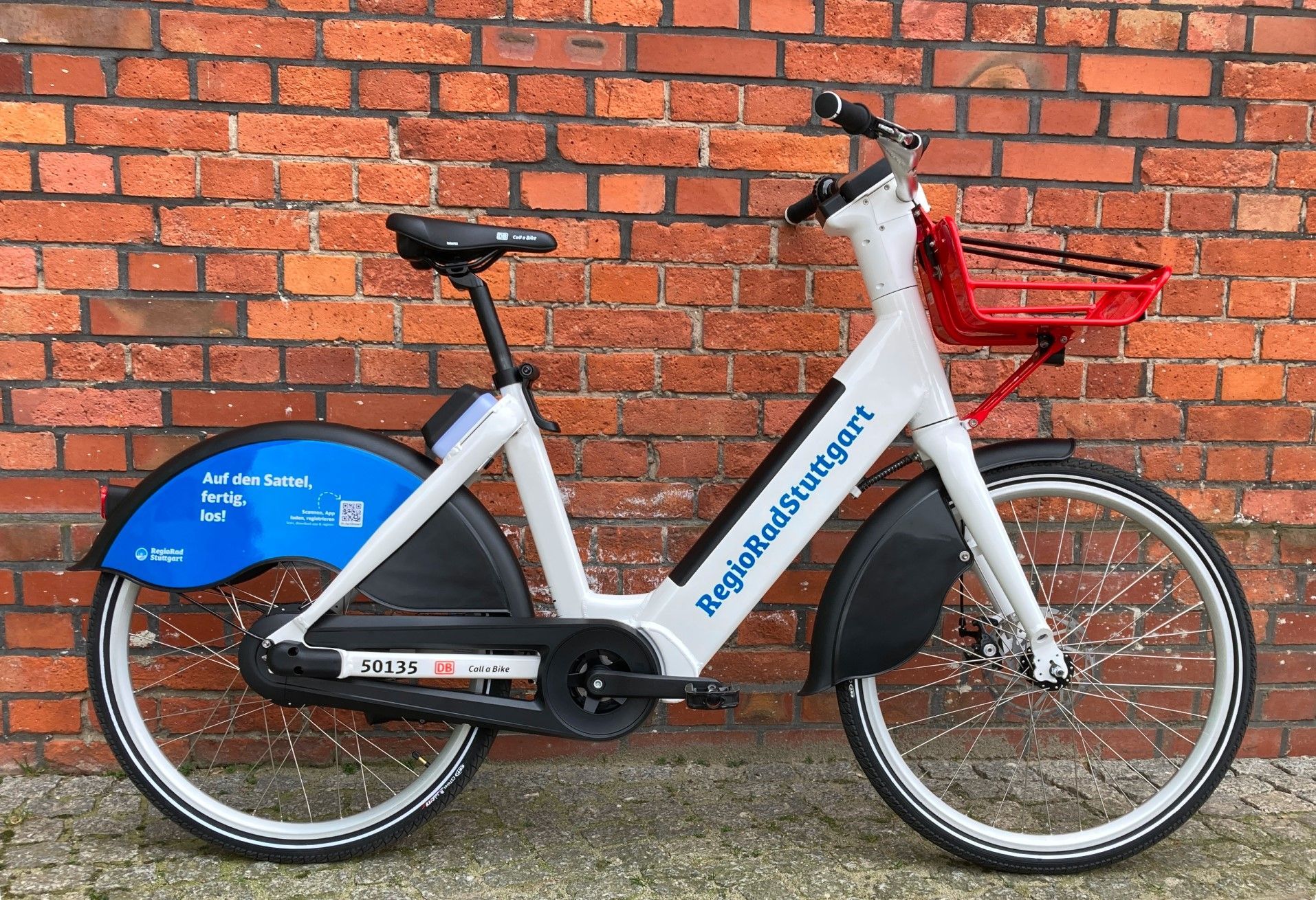 A Pedelec neo stands against a wall.